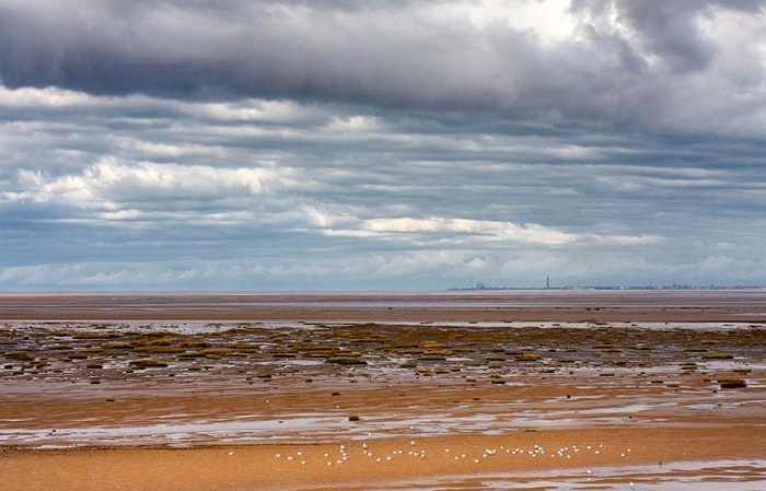 View across Southport Beach to the Lancashire coast and Blackpool,  England.